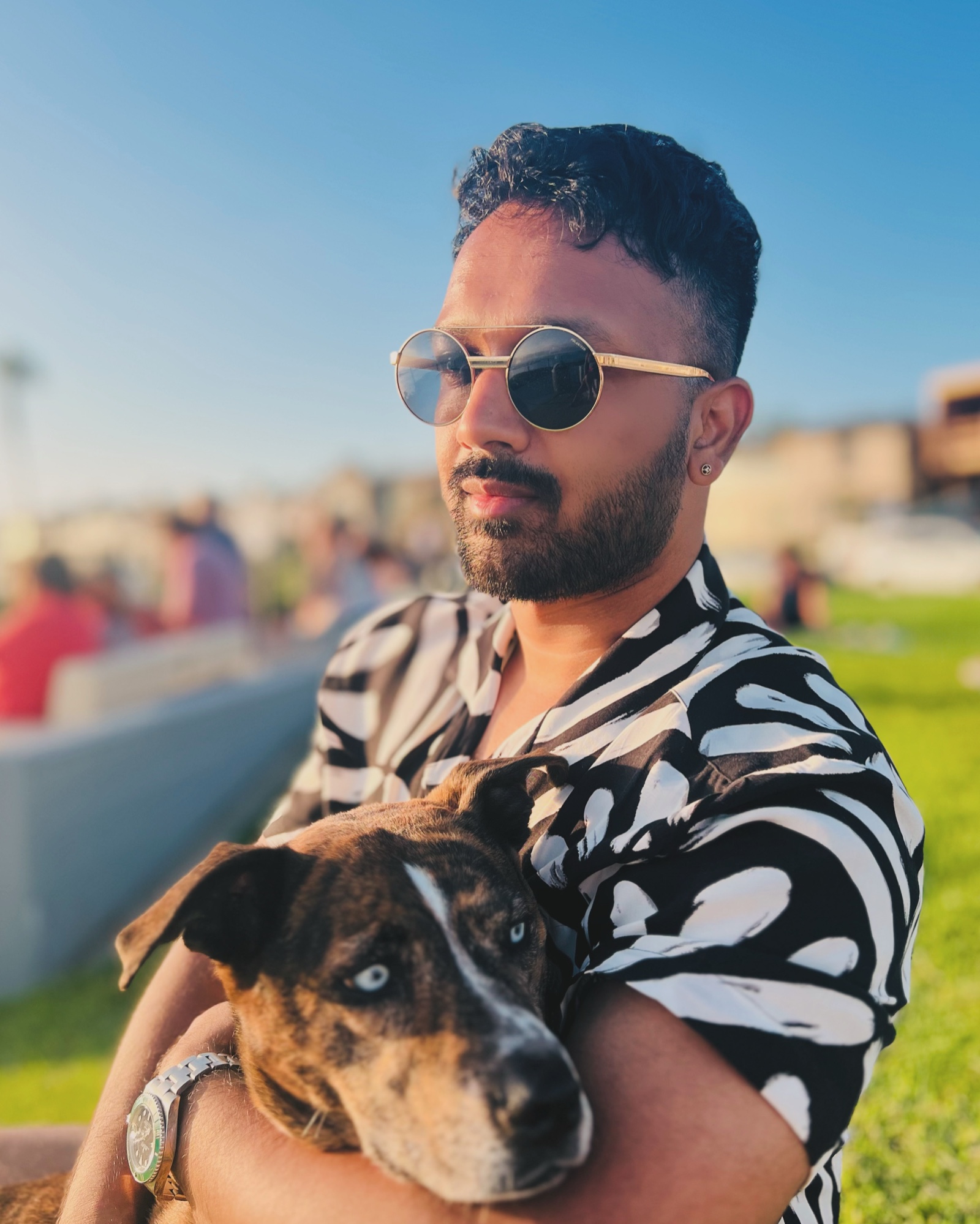 Abhi Chatterjee with his dog Thales, who has blue eyes.